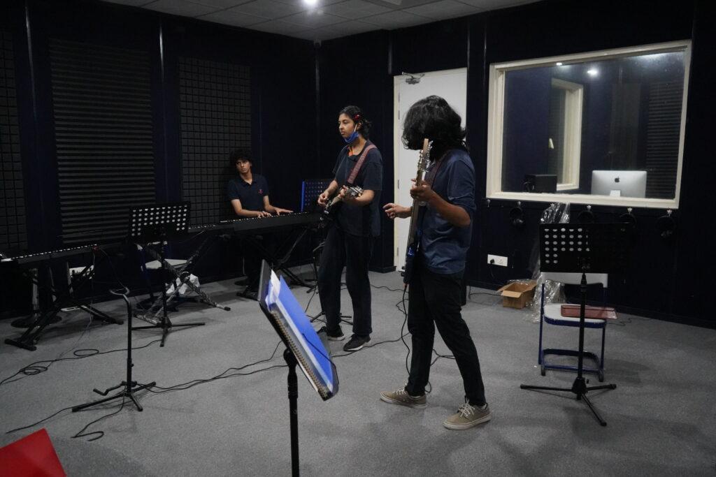 Prometheus School secondary students practicing in the recording studio.