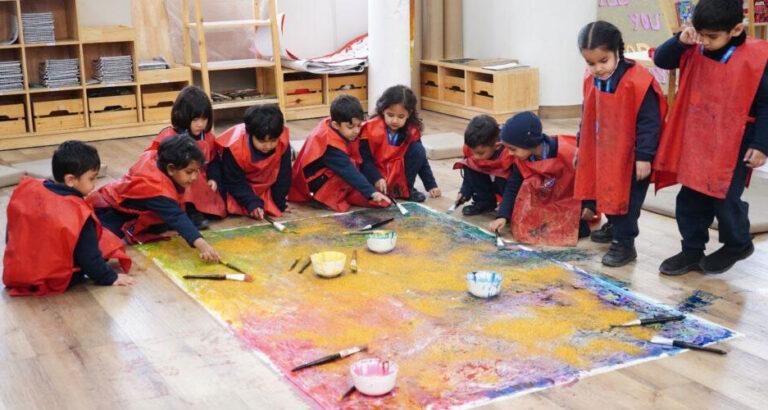 Prometheus Schools’ Early Years students engaged in a collaborative art activity in the visual arts studio.
