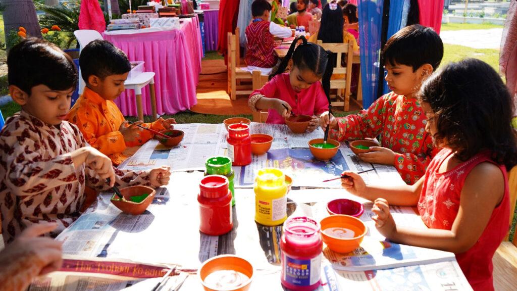 Young learners at Prometheus School enthusiastically decorating diyas as part of their vibrant Diwali festivities