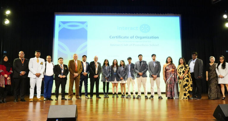 Members of the Interact Club captured with esteemed dignitaries, senior leadership, and the organizing committee