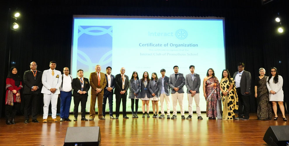 Members of the Interact Club captured with esteemed dignitaries, senior leadership, and the organizing committee