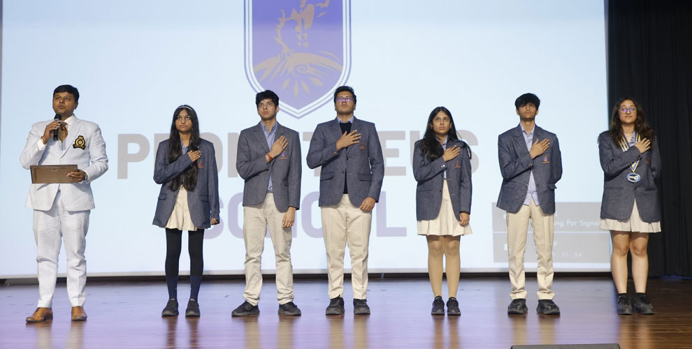 The newly elected Interact Club members formally taking their oath, administered by Rtn. Kushagra Awasthi, President of the Rotary Club