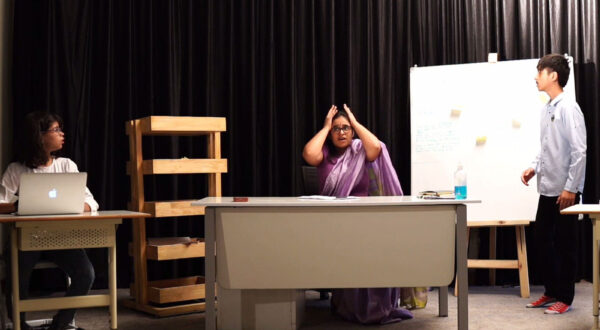 Prometheus School students practicing a theatrical performance with expressive gestures and engaging body language