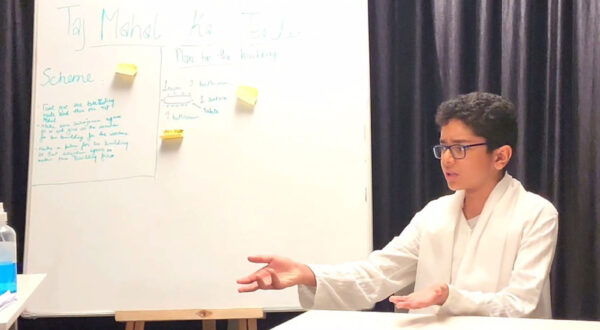 close-up of a Prometheus School student performing in the drama room, highlighting expressive emotions and detailed acting
