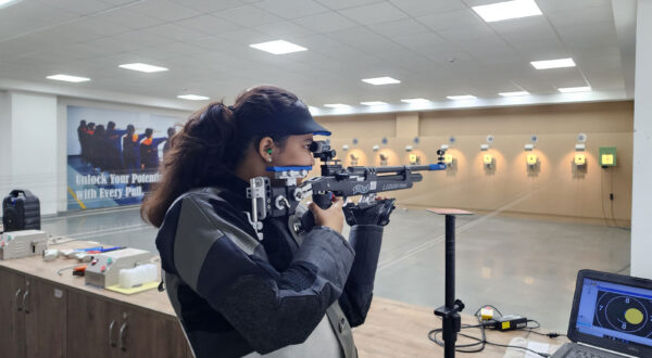 Rifle shooting practice: A Prometheus School girl, fully equipped in a professional shooting suit, practices rifle shooting at the range