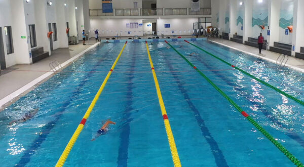 Skilful movement: A student gracefully performs the backstroke, showcasing their swimming skills