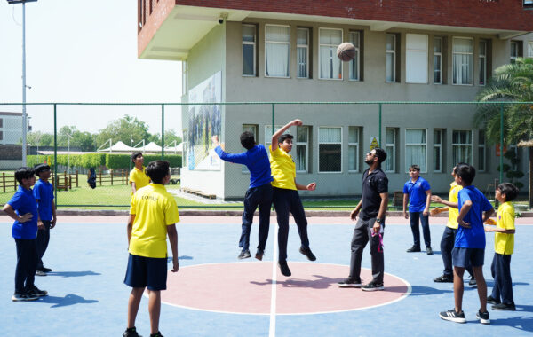 Sapphire vs Topaz competition-Sapphire and Topaz house students engage in an intense interhouse basketball competition on the court