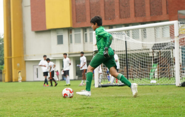 Goal attempt-A Prometheus School student kicks the ball determinedly in an interschool football competition