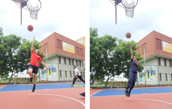 Prometheus School student gracefully jumps and shoots the basketball into the hoop, showcasing precision and skill