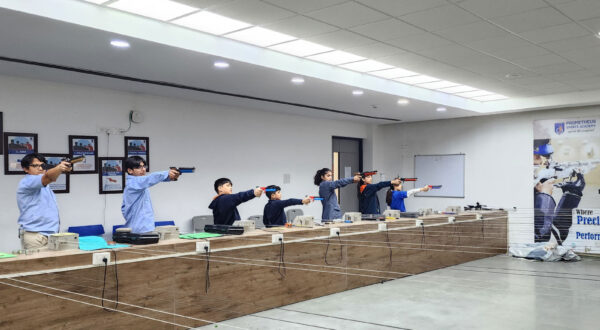 After-school academy training: Prometheus School students engage in pistol shooting practice during an after-school academy session