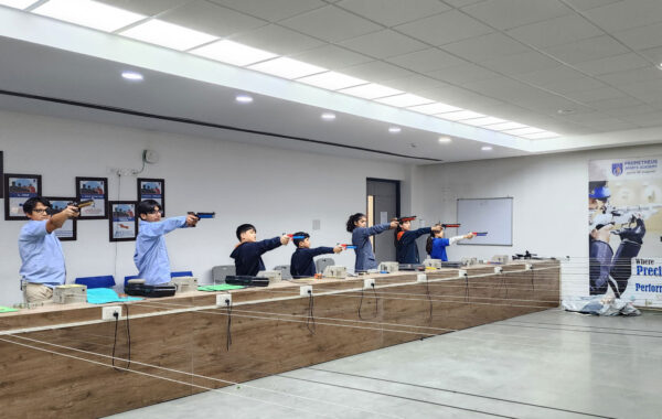 After-school academy training: Prometheus School students engage in pistol shooting practice during an after-school academy session