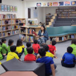 Immersed in the World of Stories – Students participate in a story reading session in the library, fostering a love for literature in a warm and inspiring learning space.