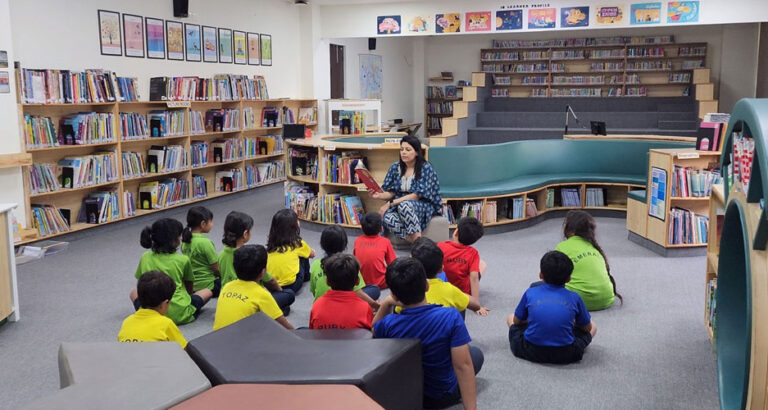 Immersed in the World of Stories – Students participate in a story reading session in the library, fostering a love for literature in a warm and inspiring learning space.
