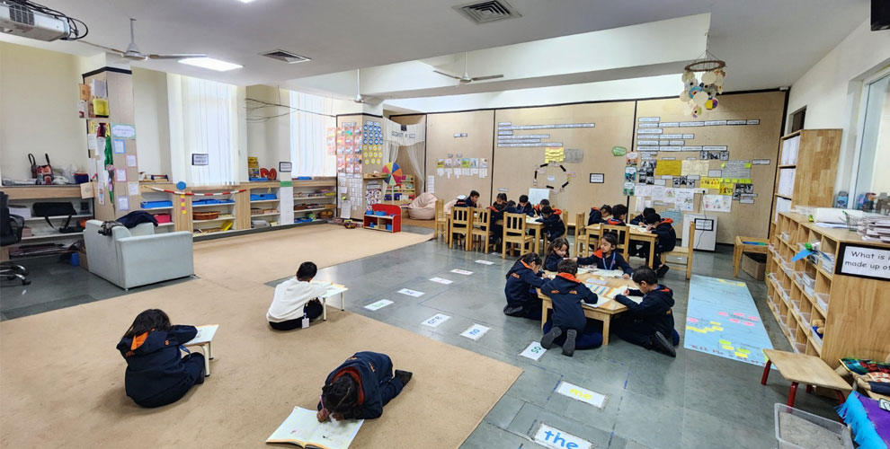 Active Learning in the Classroom – Prometheus students immerse themselves in learning, working diligently on their tasks in a collaborative and engaging classroom environment.