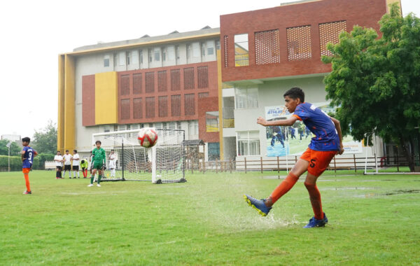 Goalkeeper's save-A Prometheus School student, playing as goalkeeper, dives to save the ball with exceptional focus