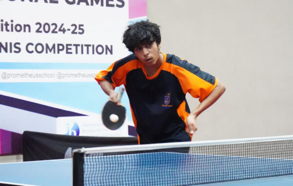 Technical serve-A Prometheus School student demonstrates the reverse pendulum technique during a service
